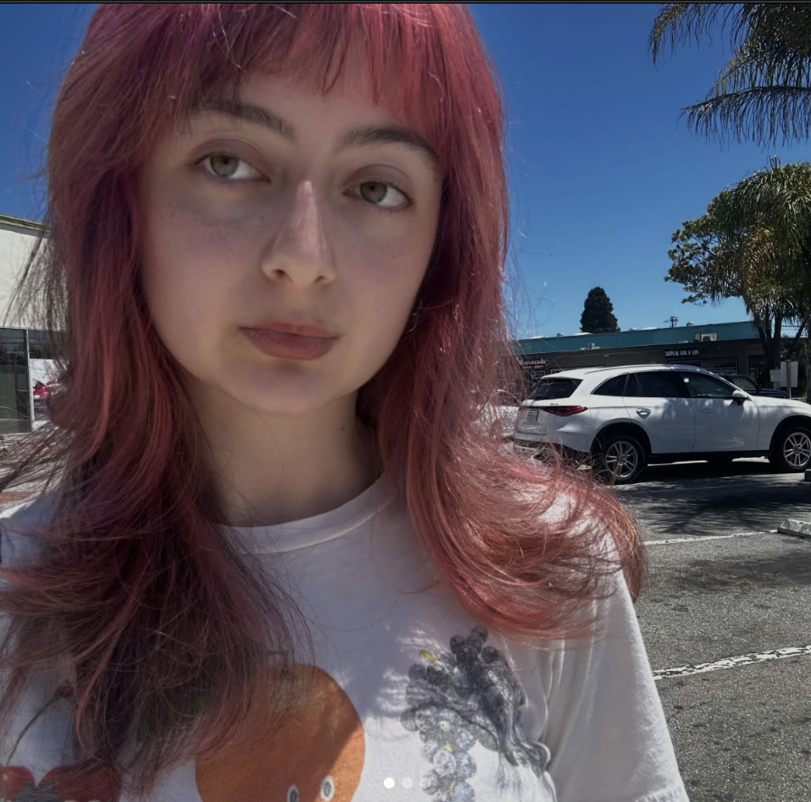 A pink shag with bangs, out on Seabright